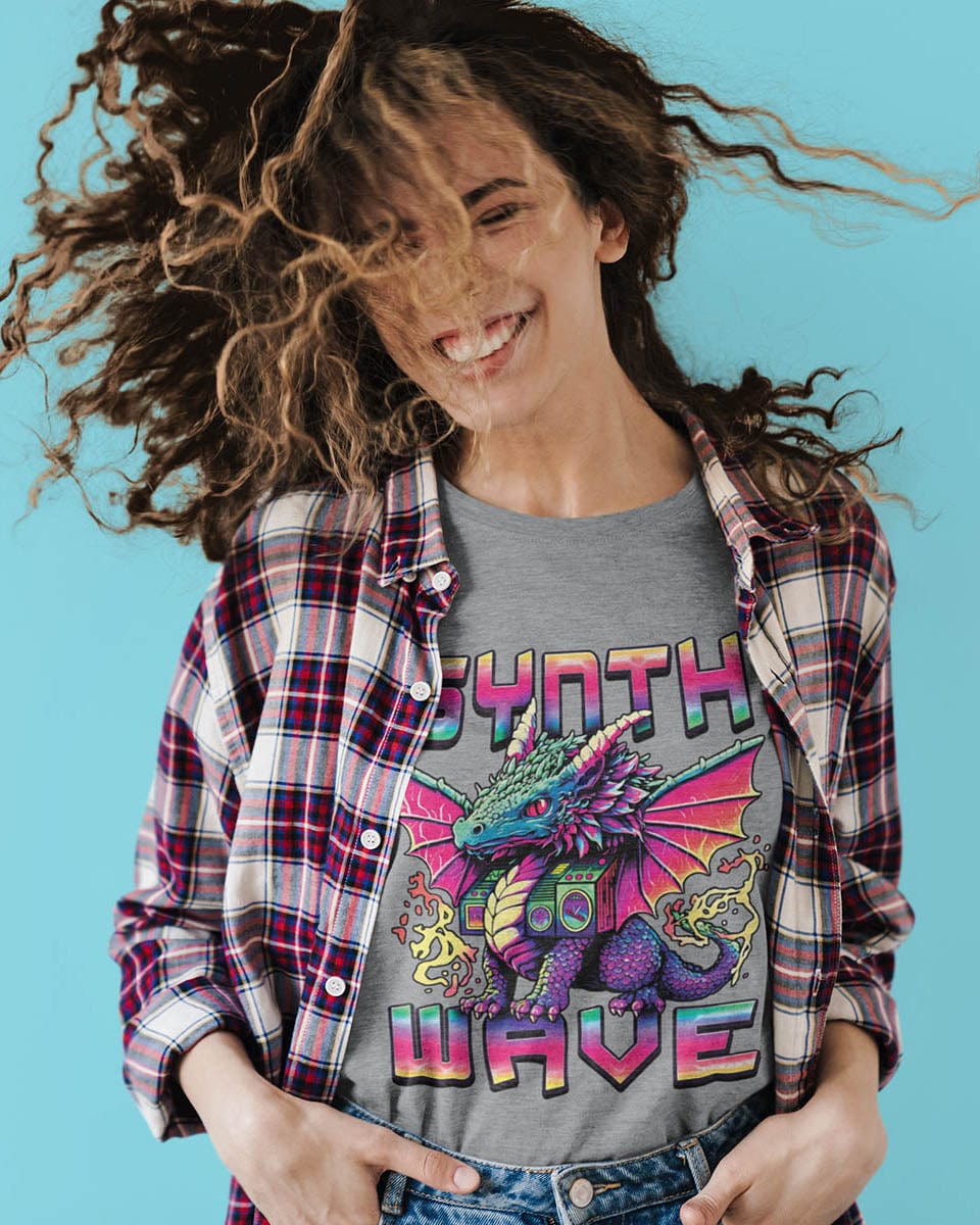 Woman dancing in a Synthwave Dragon shirt featuring the word "SYNTHWAVE" and neon art of a young dragon with a boombox.