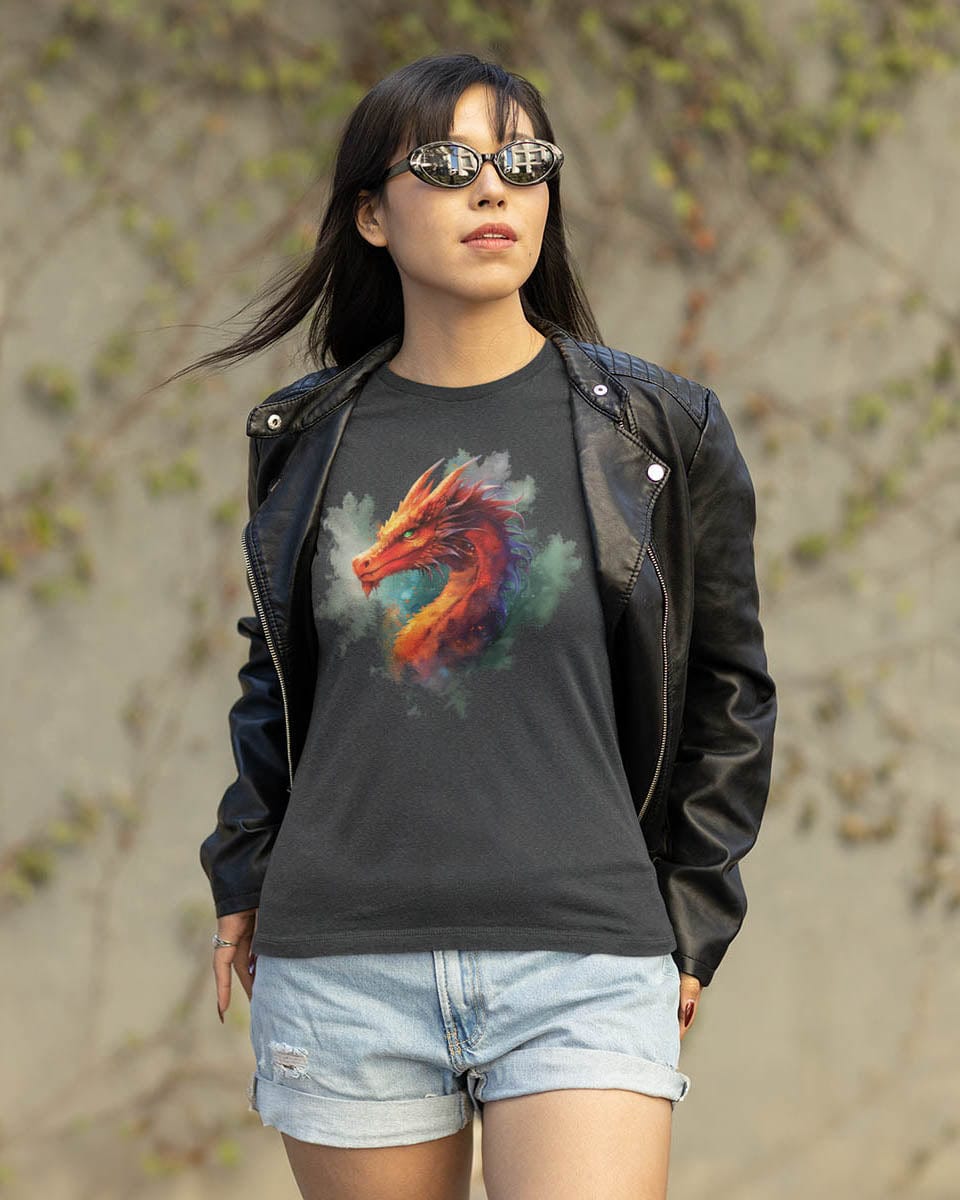 Woman in sunglasses outside wearing a leather jacket over a Crimson Majestic Dragon shirt featuring ethereal watercolor art.
