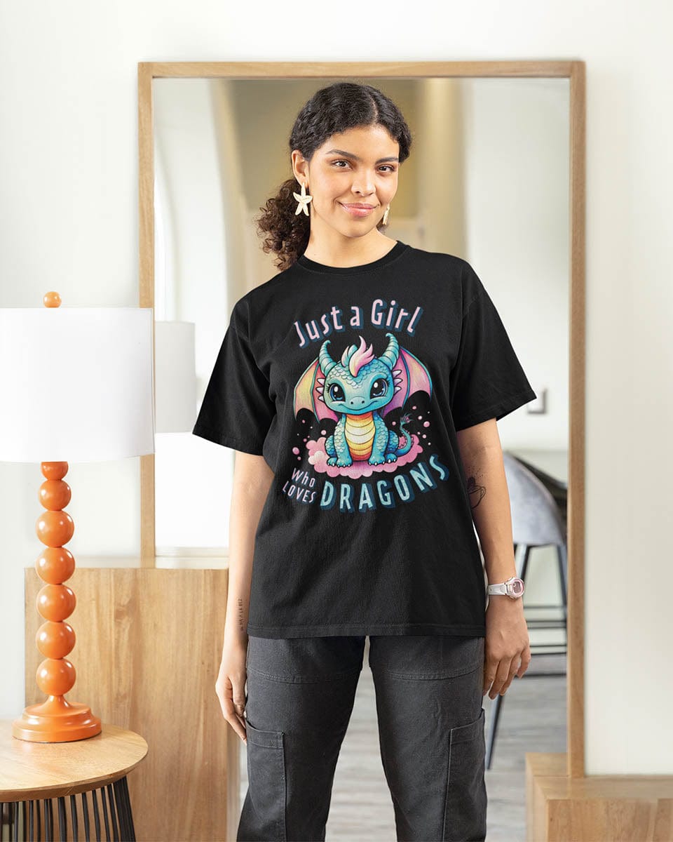 Woman wearing a Just a Girl Who Loves Dragons shirt in black, featuring an adorable wide-eyed dragon in pastel colors.
