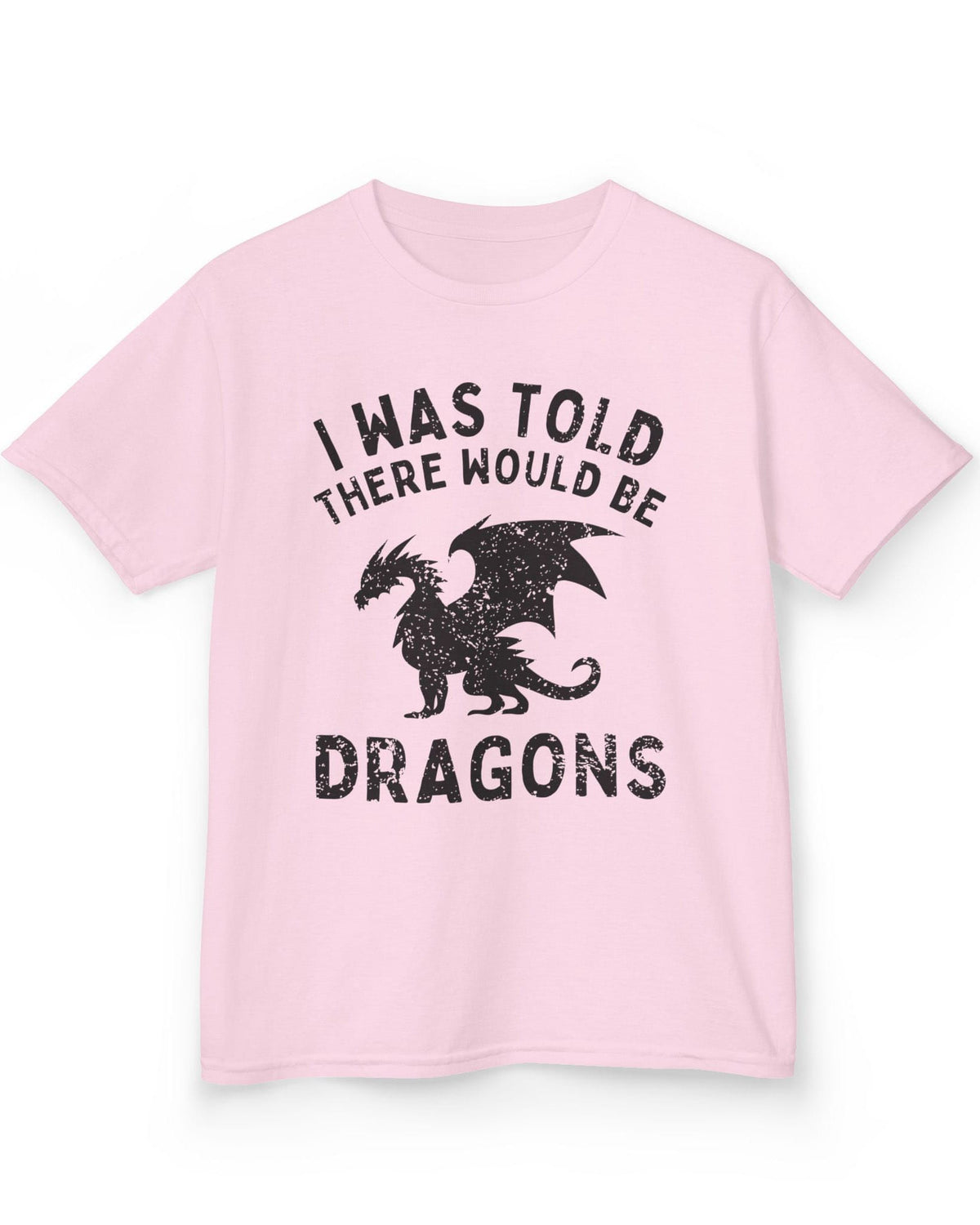 I Was Told There Would Be Dragons shirt in light pink, featuring distressed text and a bold dragon silhouette.