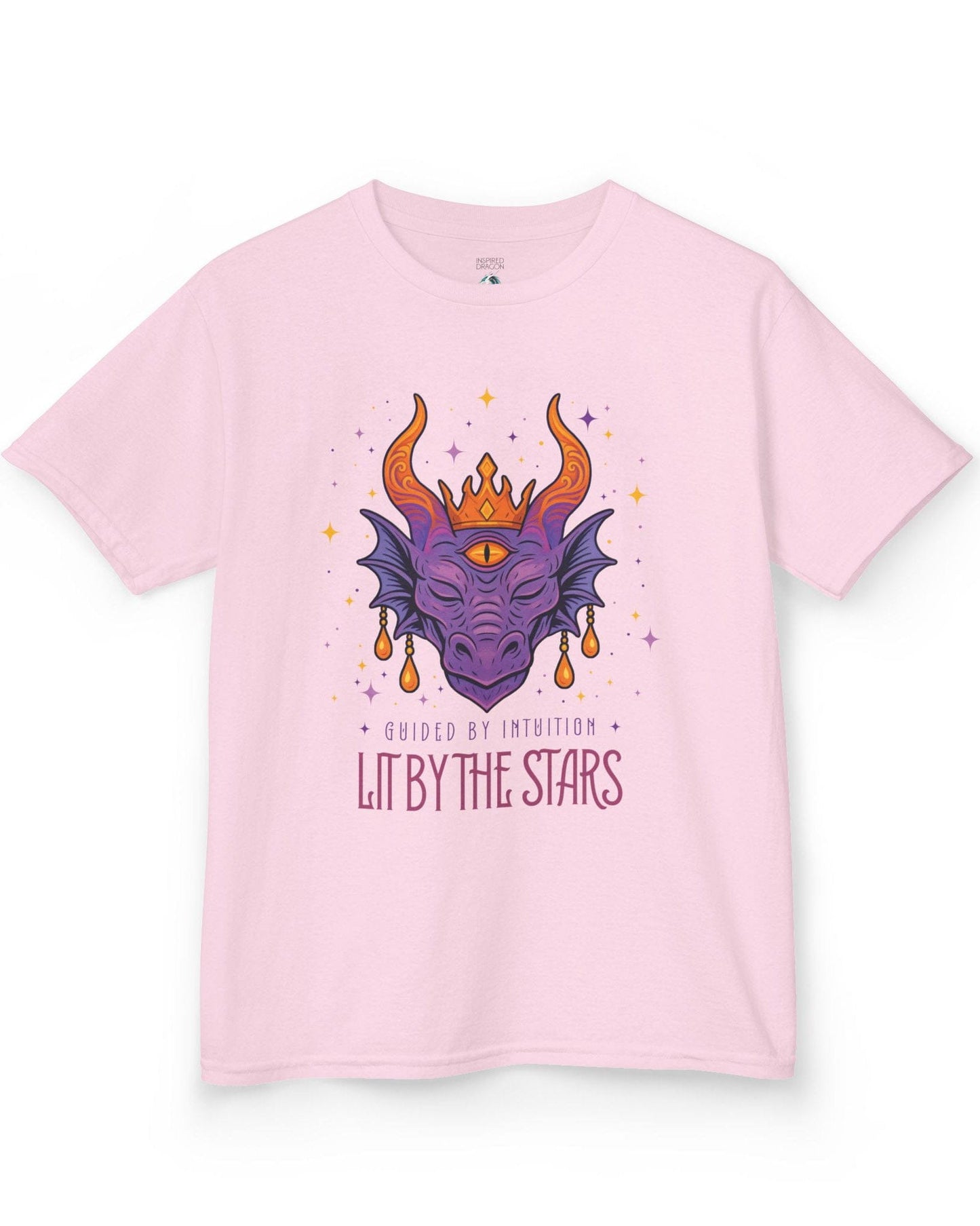 Lit by the Stars shirt in light pink featuring a crowned purple dragon with a third eye, surrounded by colorful stars.