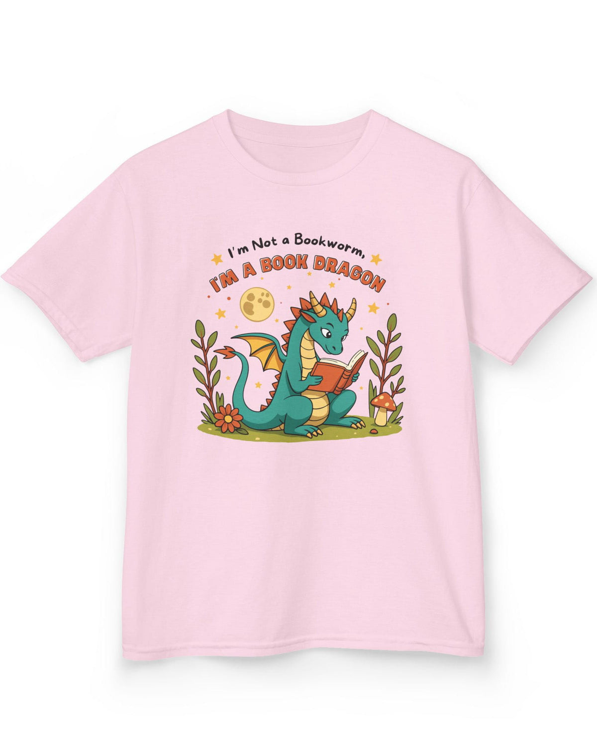 I'm a Book Dragon shirt in light pink featuring a teal dragon reading under the moonlight with plants and mushrooms