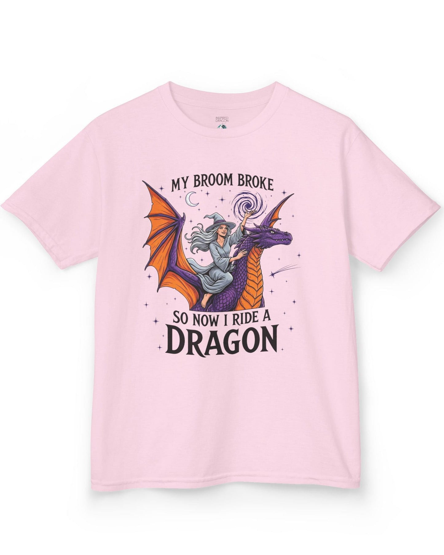 My Broom Broke Magical shirt in light pink featuring a magical witch riding a purple dragon beneath a starry night sky