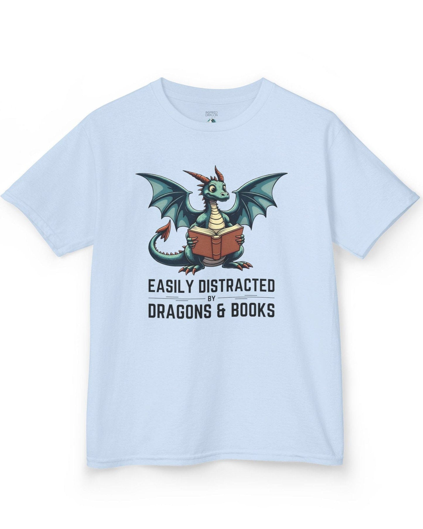 Easily Distracted by Dragons & Books shirt in light blue featuring a teal dragon reading an open book with wide eyes.