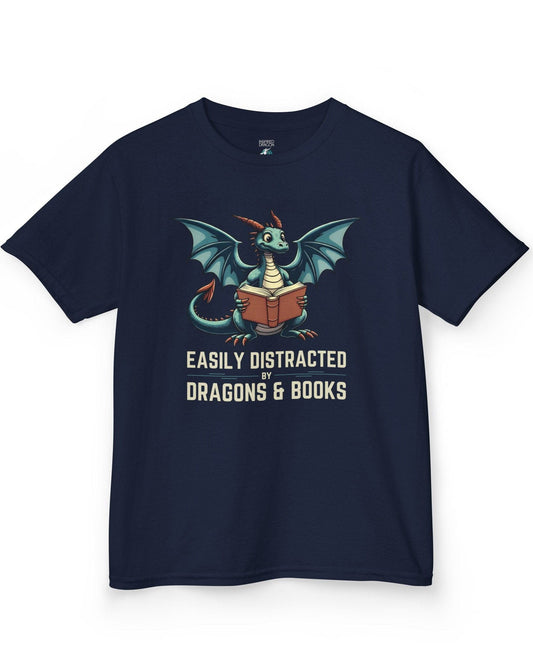 Easily Distracted by Dragons & Books shirt in navy featuring a teal dragon reading an open book with wide eyes.