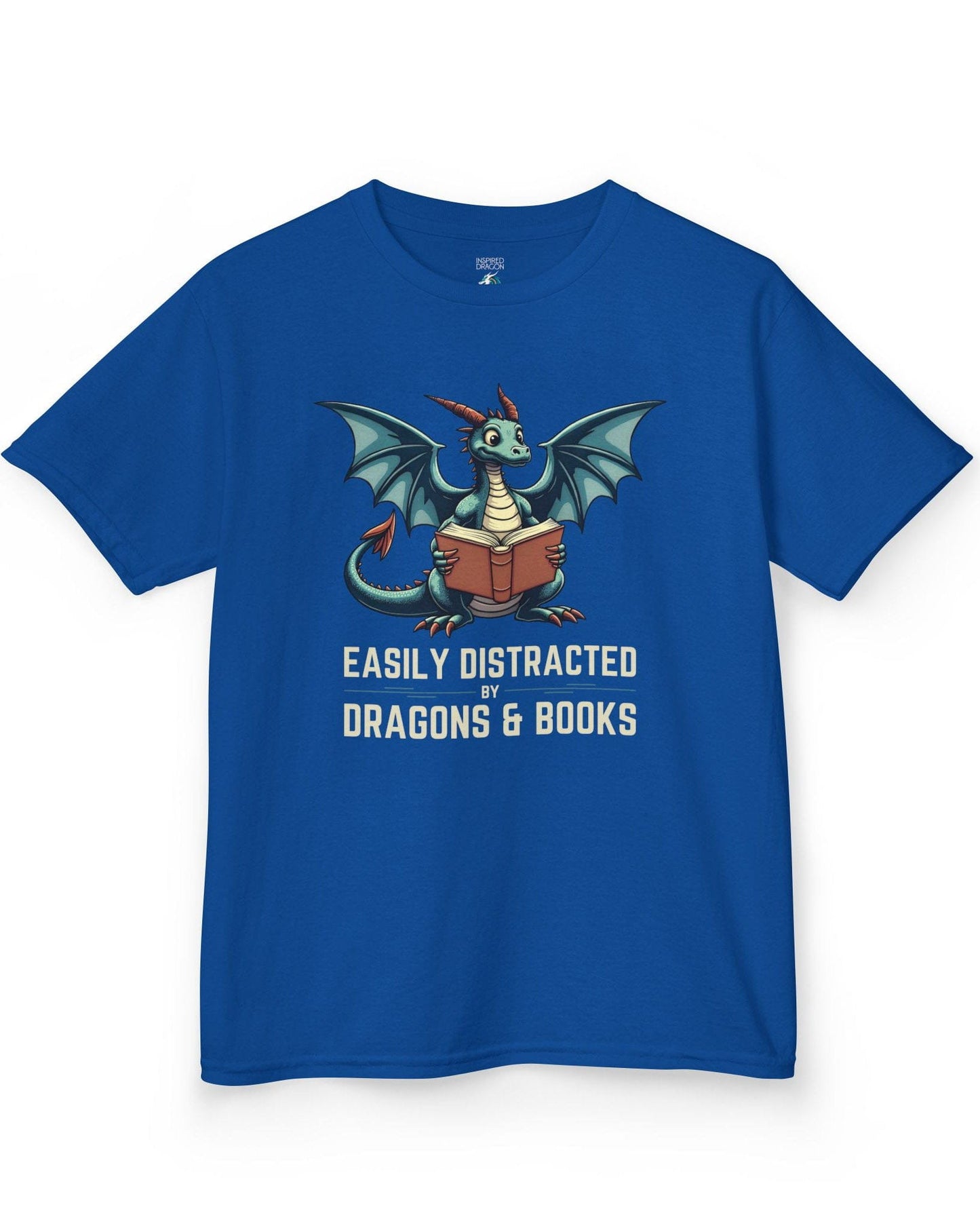 Easily Distracted by Dragons & Books shirt in royal blue featuring a teal dragon reading an open book with wide eyes.