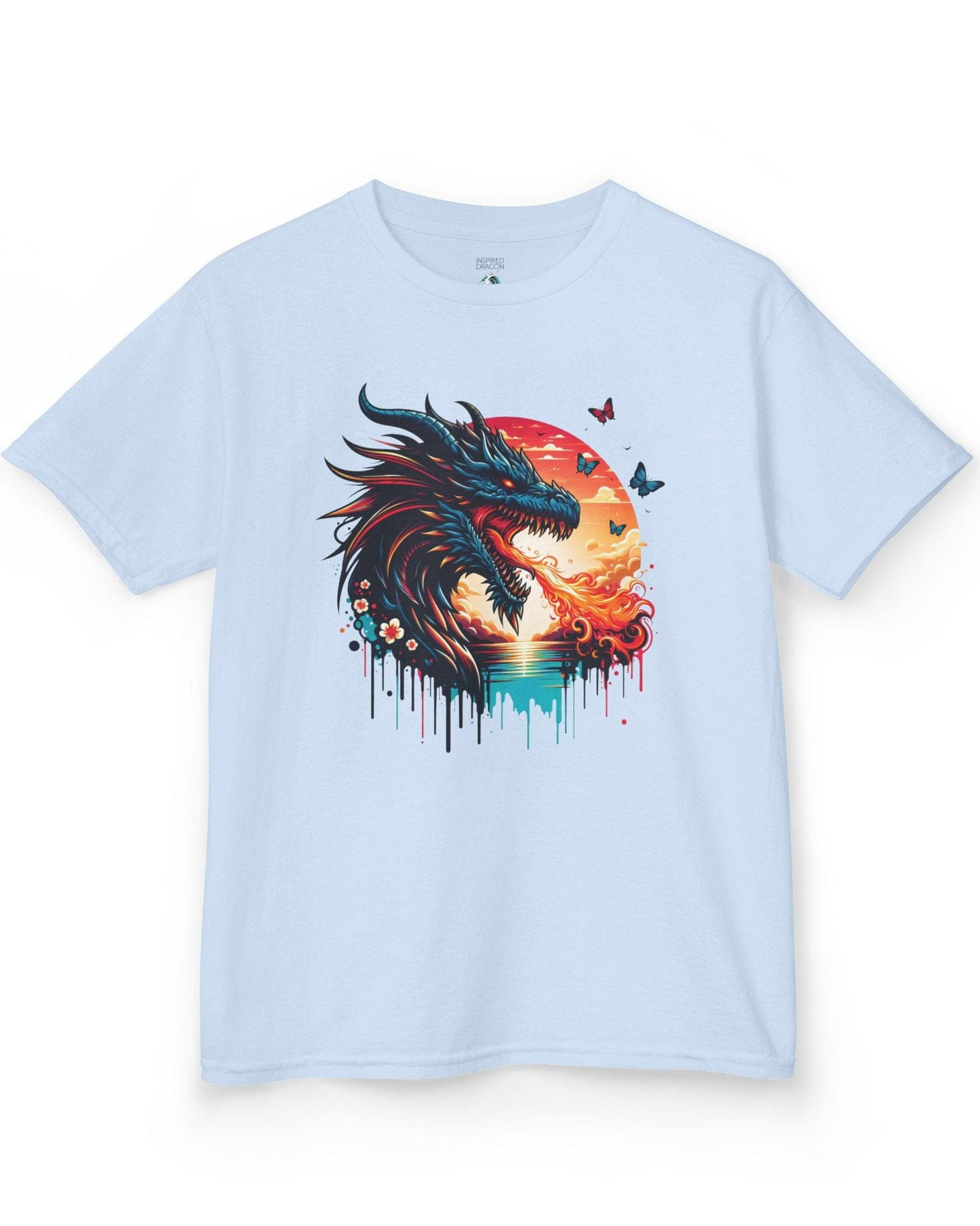 Sunset Inferno shirt in light blue featuring a fire-breathing dragon against a vibrant sunset with floral accents.