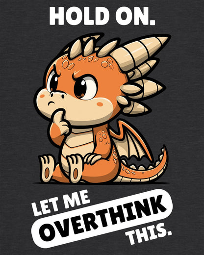 Let Me Overthink This shirt in dark heather grey, featuring a thoughtful cartoon dragon with bold white and black text.