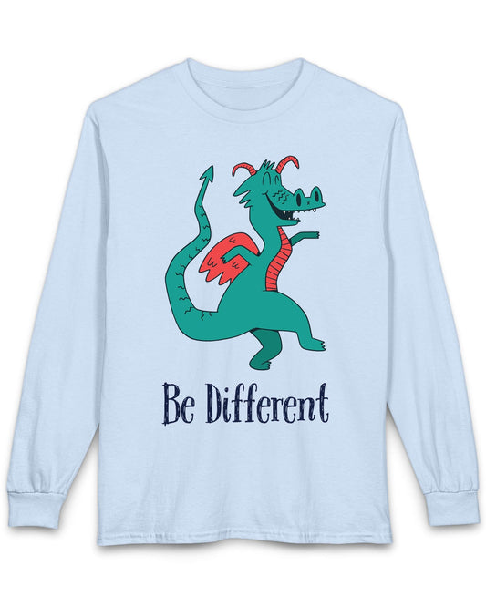 Be Different shirt in light blue featuring a quirky teal dragon with red wings dancing joyfully with text underneath.
