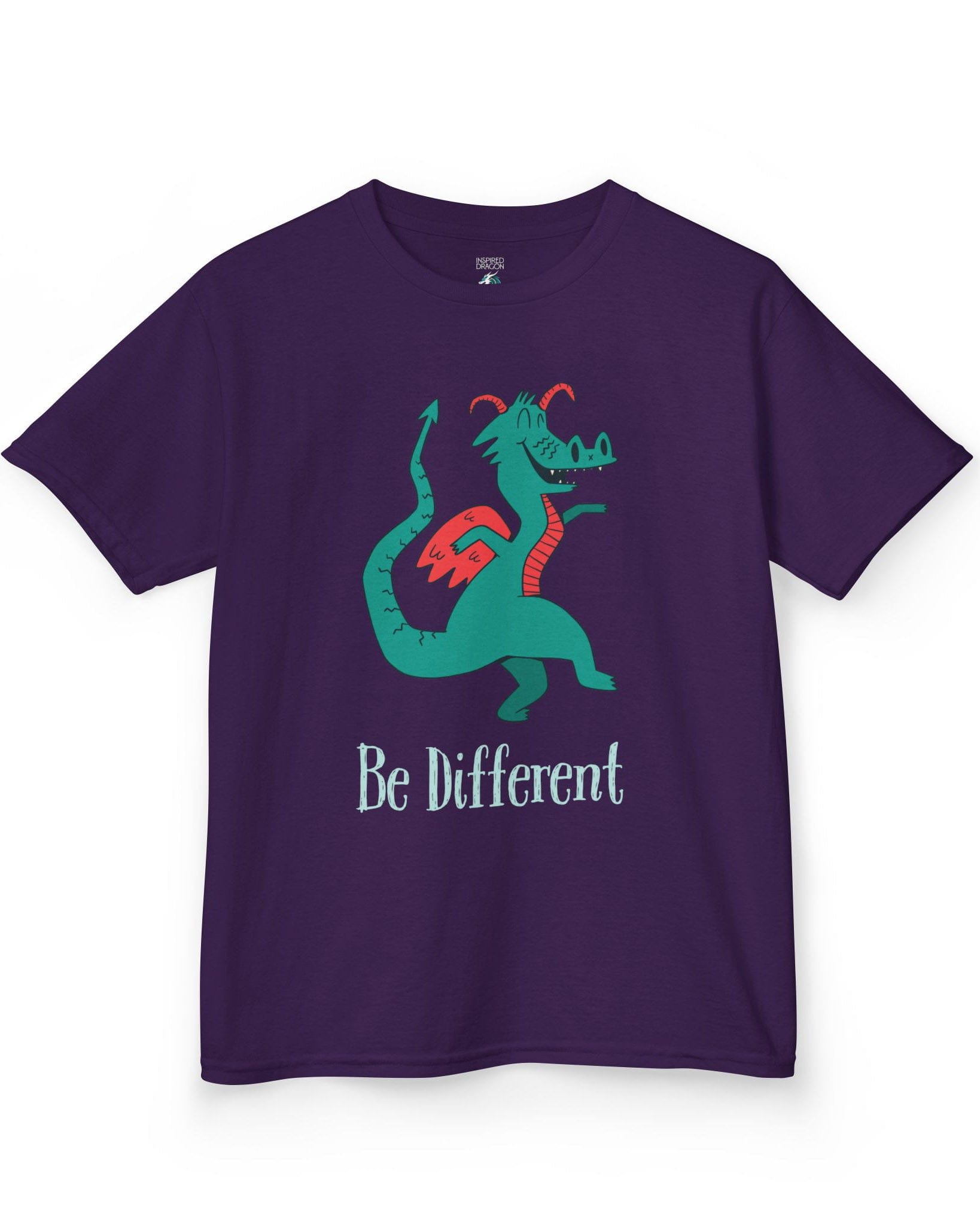 Be Different shirt in purple featuring a quirky teal dragon with red wings dancing joyfully with text underneath.