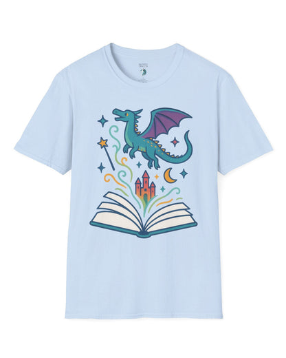 The Story Takes Flight shirt in light blue featuring a blue dragon flying from an open book with magic and a castle.
