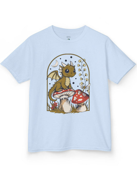 Moonlit Magic shirt in light blue featuring a wide-eyed dragon sitting on a mushroom beneath a crescent moon.