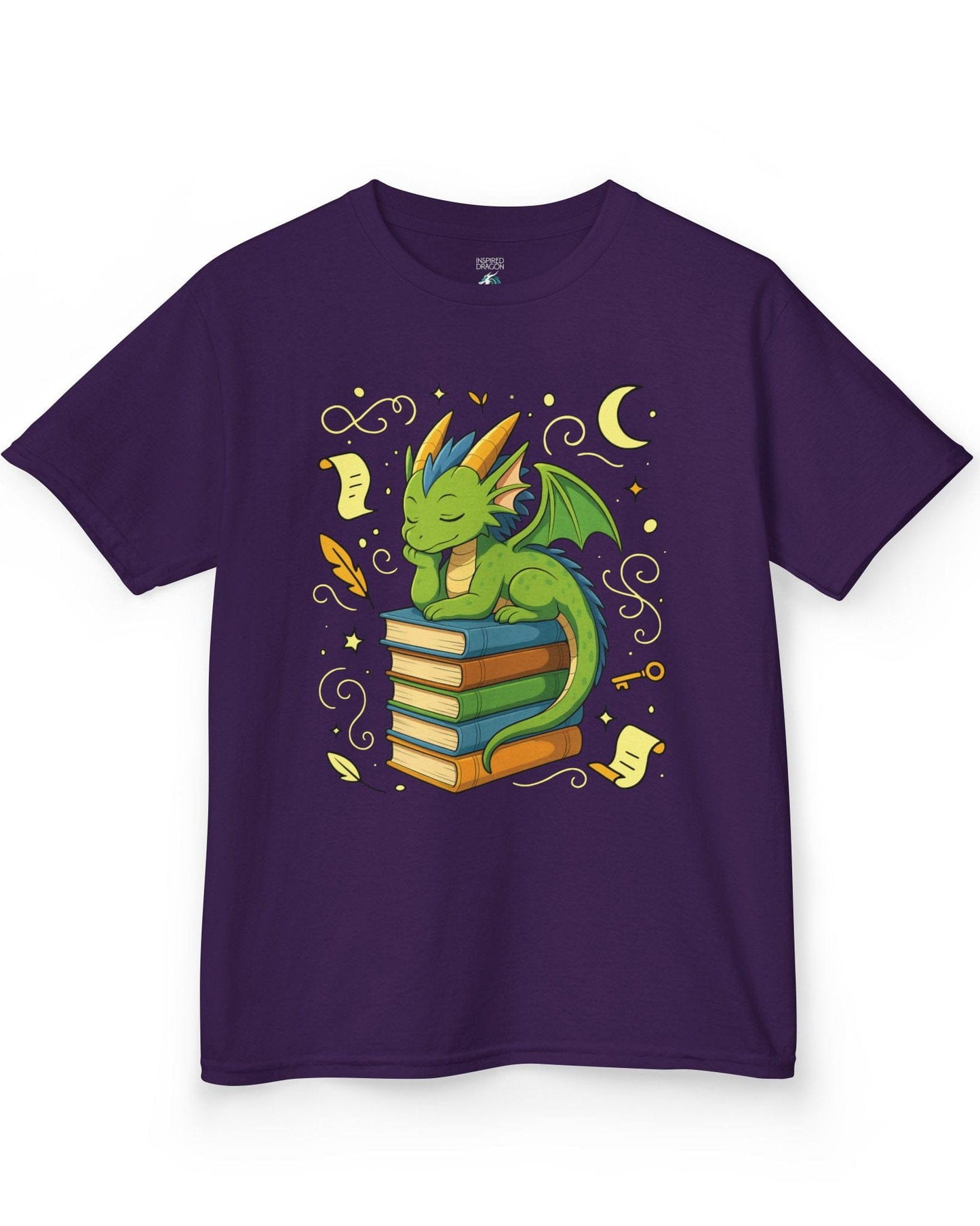 Enchanted Daydreamer shirt in purple, featuring a sleepy green dragon resting atop a stack of colorful books.