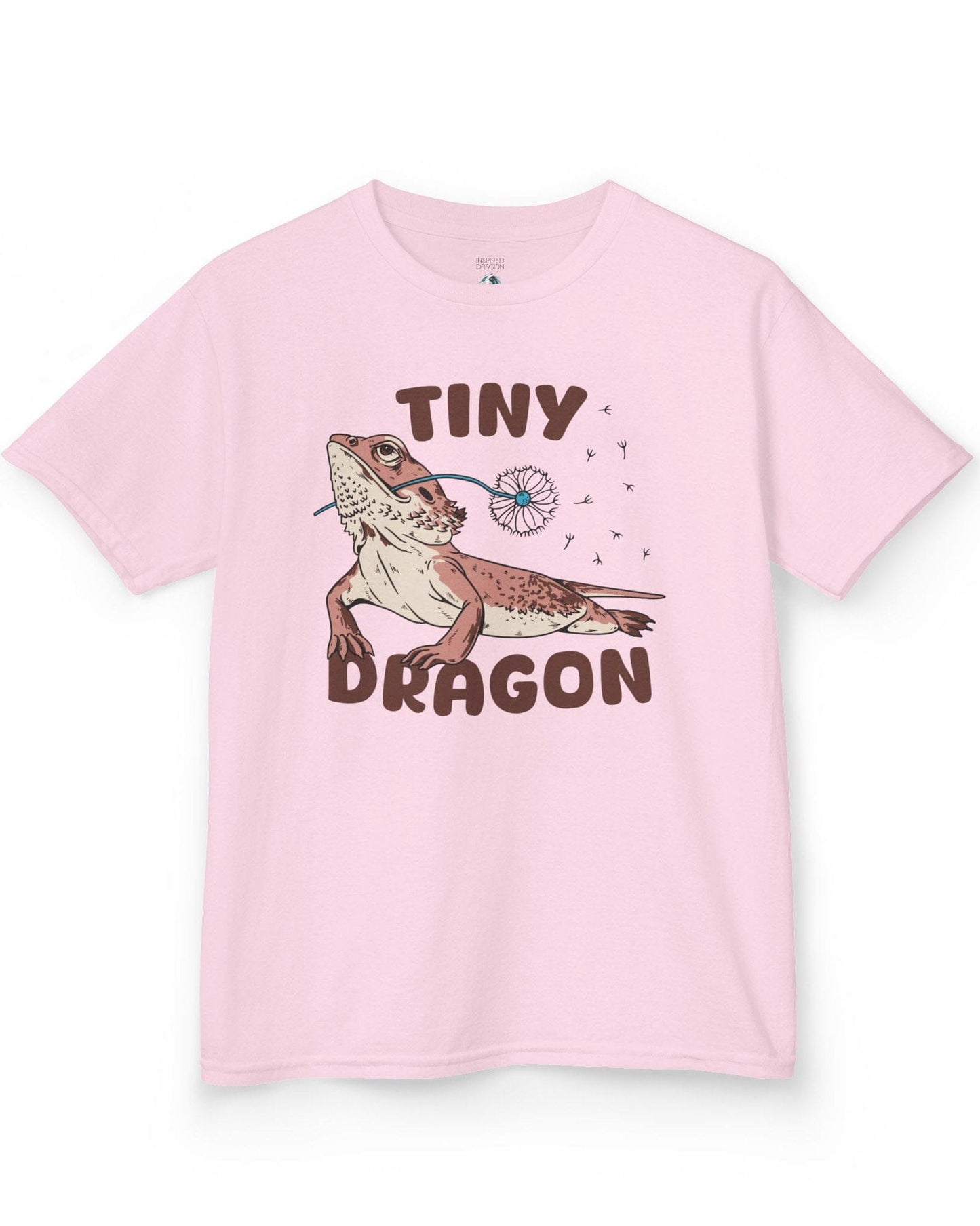 Tiny Dragon shirt in light pink, featuring puffy text and a bearded dragon holding a dandelion in its mouth.