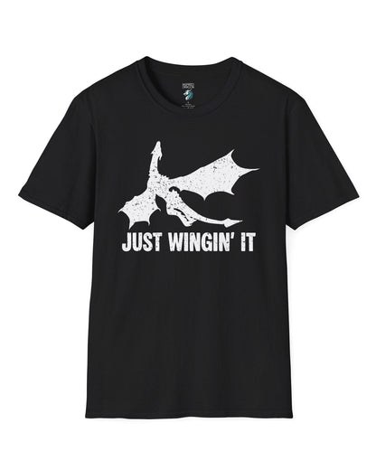 Just Wingin' It shirt in black, featuring a distressed silhouette of a flying dragon above bold text.