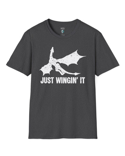 Just Wingin' It shirt in dark heather grey, featuring a distressed silhouette of a flying dragon above bold text.