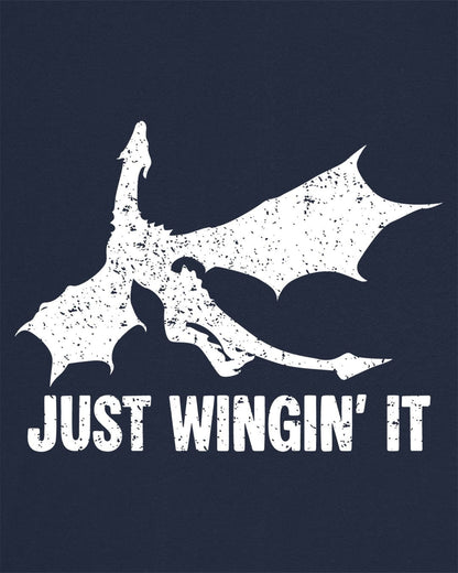 Just Wingin' It shirt in navy, featuring a distressed silhouette of a flying dragon above bold text.
