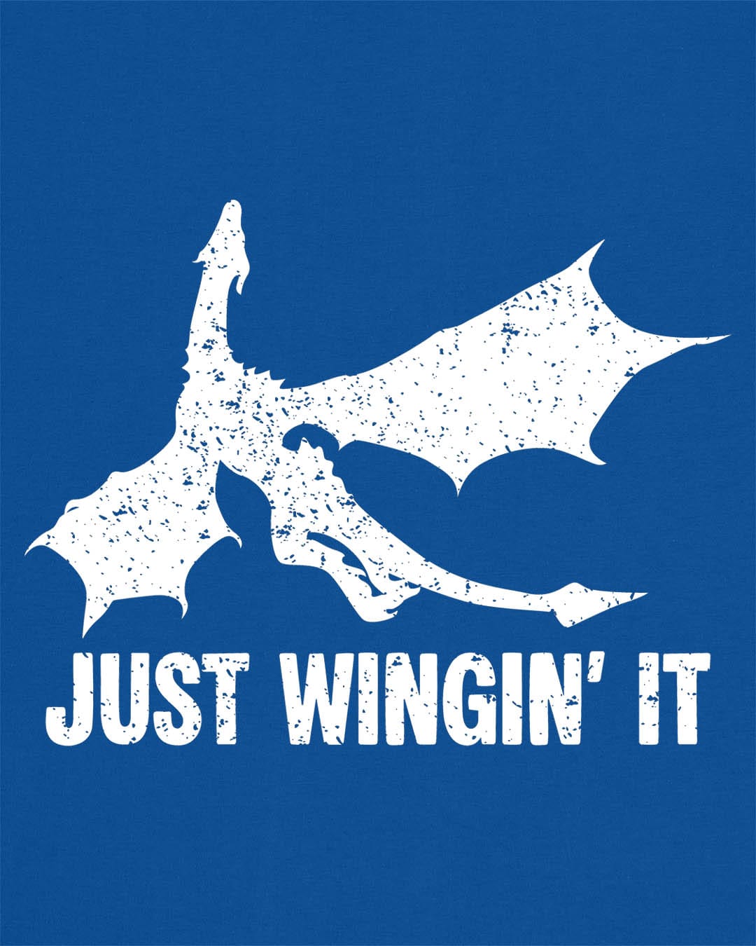 Just Wingin' It shirt in royal blue, featuring a distressed silhouette of a flying dragon above bold text.