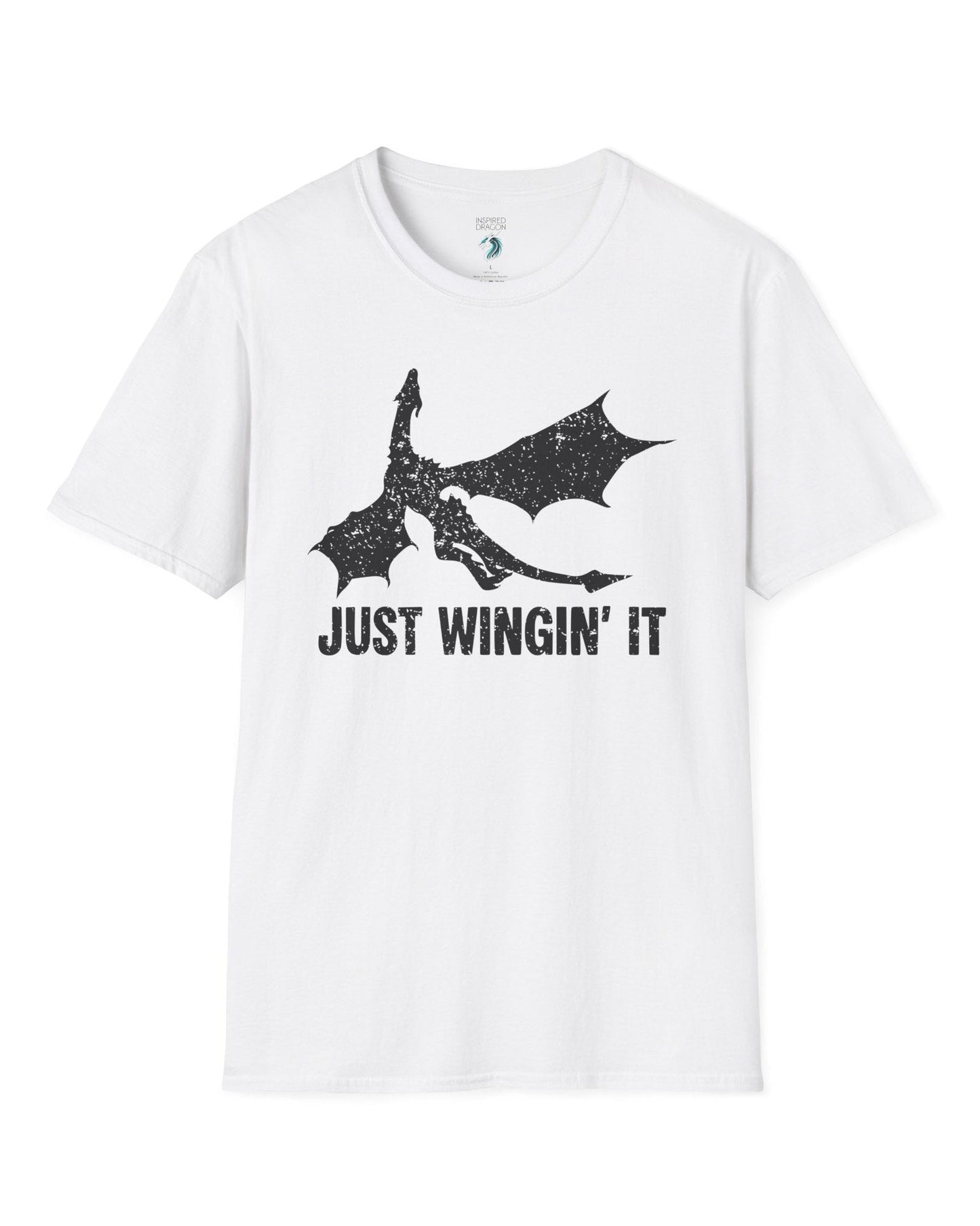 Just Wingin' It shirt in white, featuring a distressed silhouette of a flying dragon above bold text.