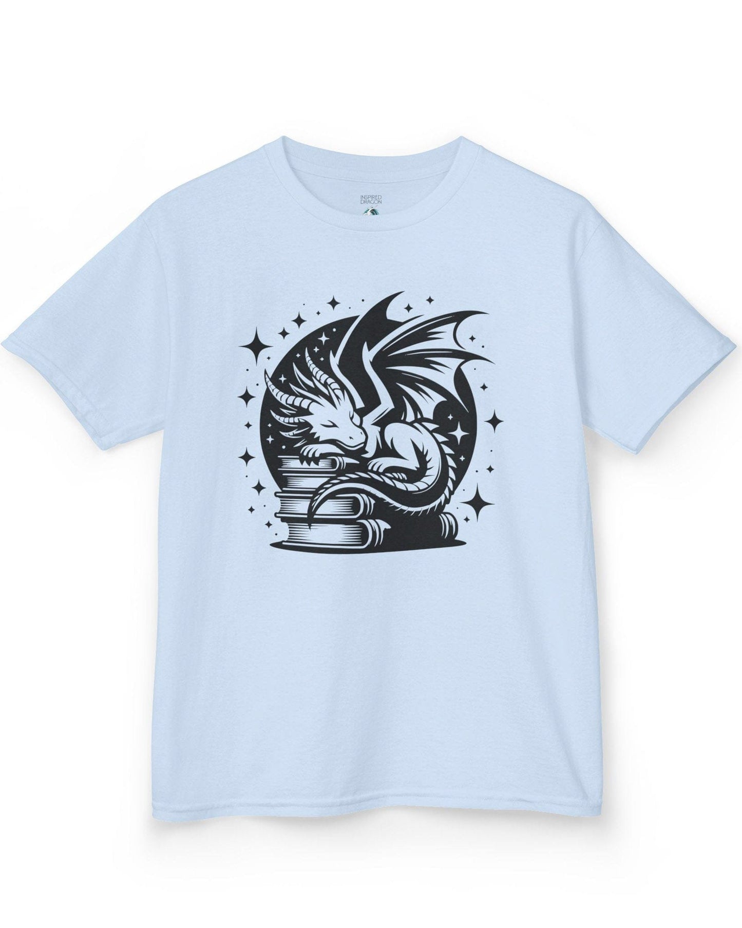 Guardian of Tales shirt in light blue, featuring a dragon sleeping atop a stack of books under a starry moon.