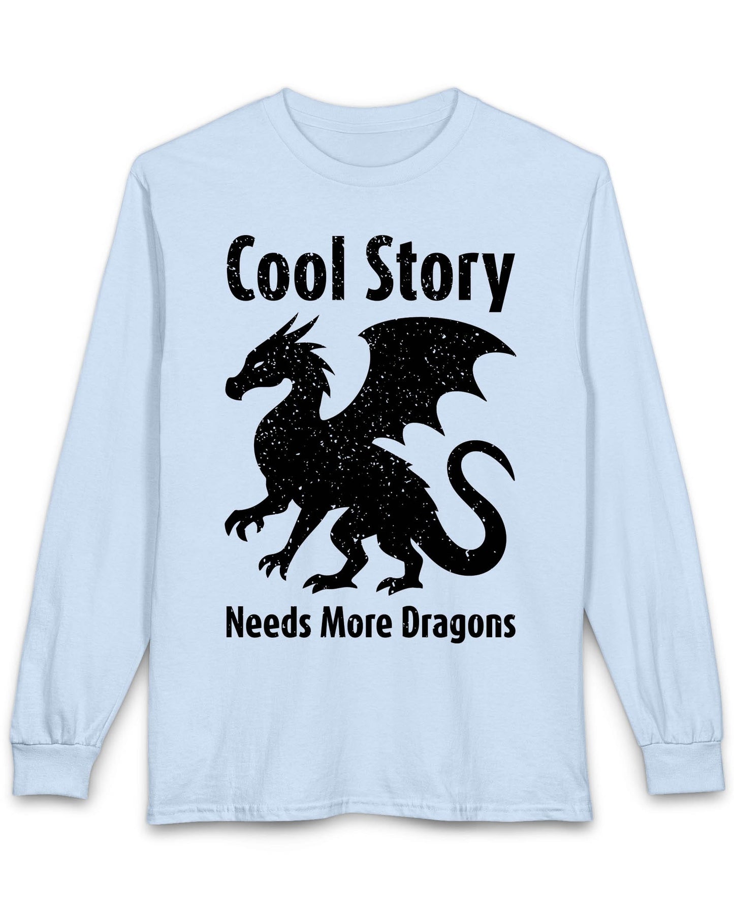 Cool Story, Needs More Dragons shirt in light blue featuring a distressed dragon silhouette with text above and below