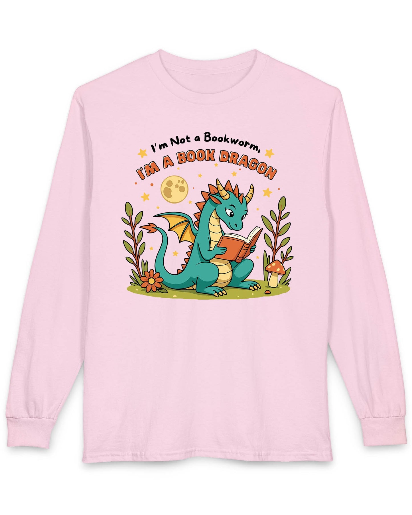 I'm a Book Dragon shirt in light pink featuring a teal dragon reading under the moonlight with plants and mushrooms