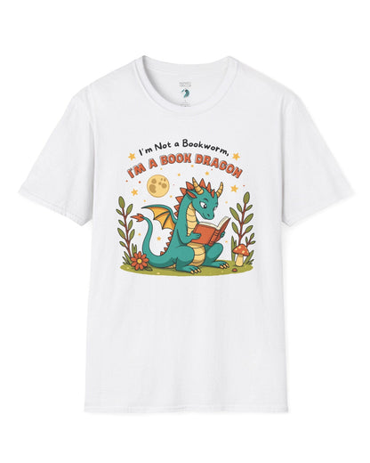 I'm a Book Dragon shirt in white featuring a teal dragon reading under the moonlight with plants and mushrooms.