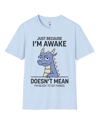 Just Because I'm Awake shirt in light blue featuring text and a sleepy dragon with a deadpan expression.