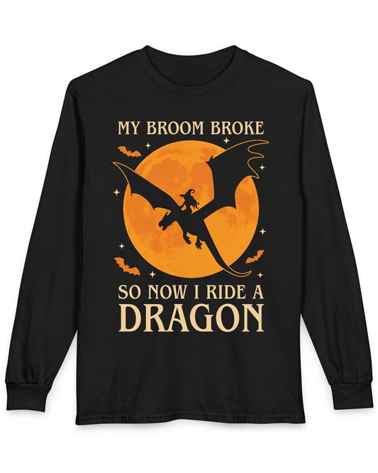 My Broom Broke shirt in black featuring a witch riding a dragon across an orange full moon with bats.