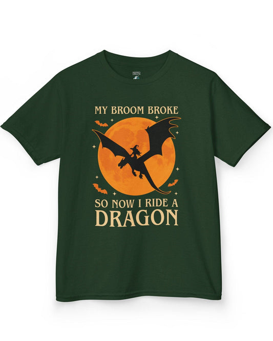 My Broom Broke shirt in forest green featuring a witch riding a dragon across an orange full moon with bats.