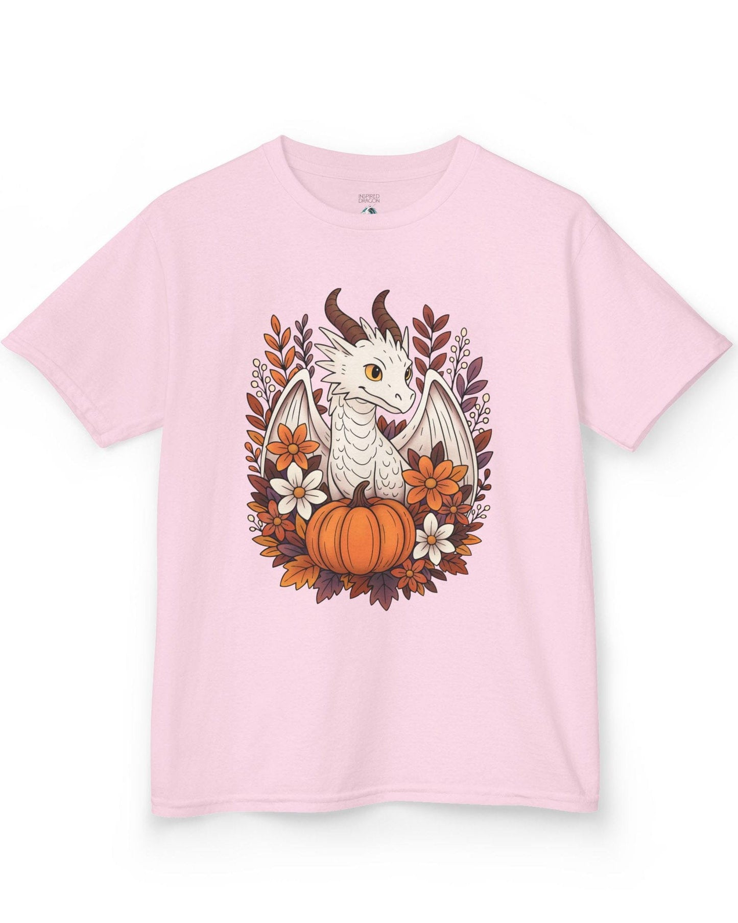 Cozy Harvest shirt in light pink featuring a white dragon surrounded by autumn flowers, leaves, and a pumpkin.