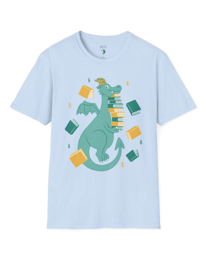 The Book Hoarder shirt in light blue featuring a cheerful teal dragon juggling a towering stack of books.