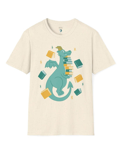 The Book Hoarder shirt in natural featuring a cheerful teal dragon juggling a towering stack of books.
