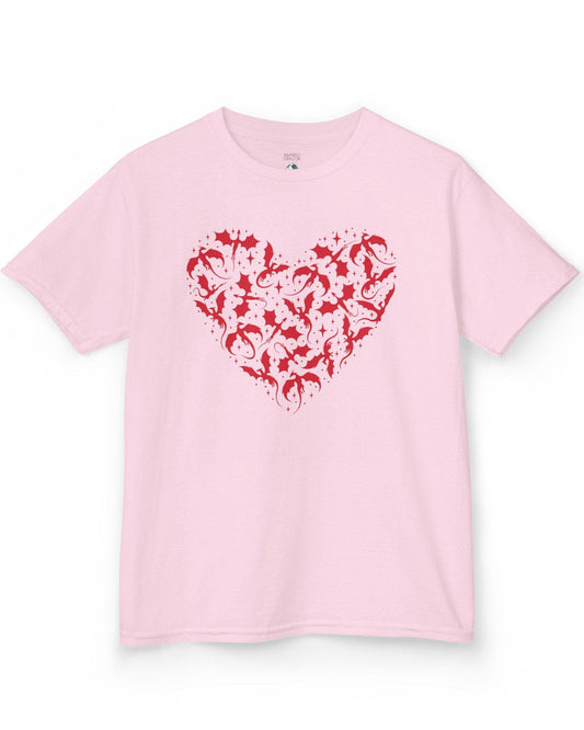 Dragonflight Heart shirt in light pink featuring a heart formed from flying dragon silhouettes with small star accents