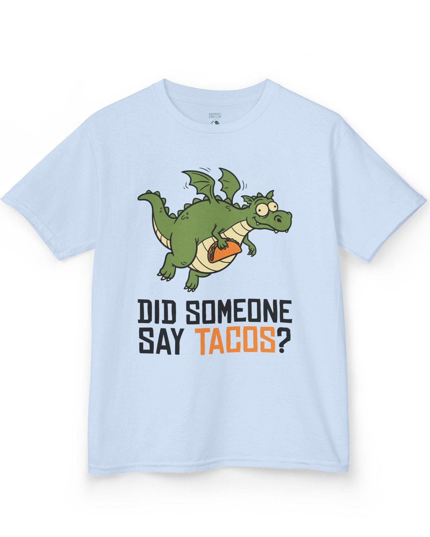 Did Someone Say Tacos shirt in light blue featuring a goofy green dragon flying with a taco and bold playful lettering