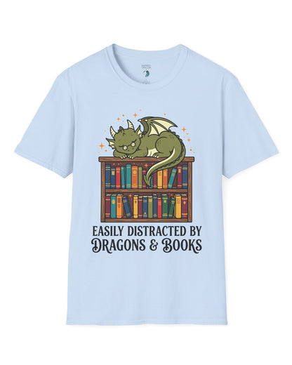 Easily Distracted by Dragons & Books shirt in light blue with a sleepy bookworm dragon lounging on a colorful bookshelf