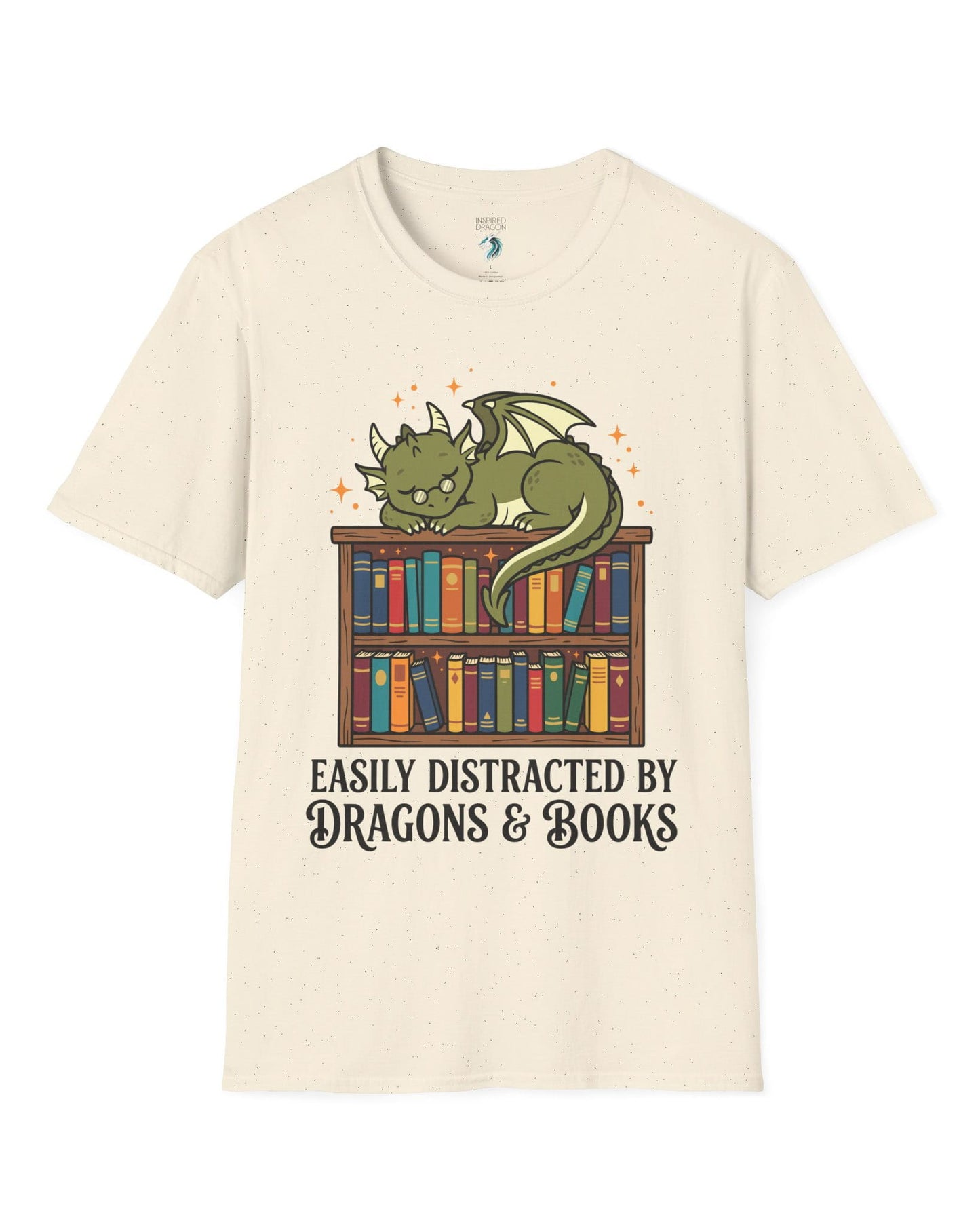 Easily Distracted by Dragons & Books shirt in natural with a sleepy bookworm dragon lounging on a colorful bookshelf