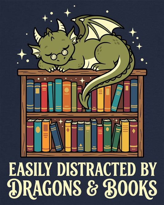 Easily Distracted by Dragons & Books shirt in navy with a sleepy bookworm dragon lounging on a colorful bookshelf