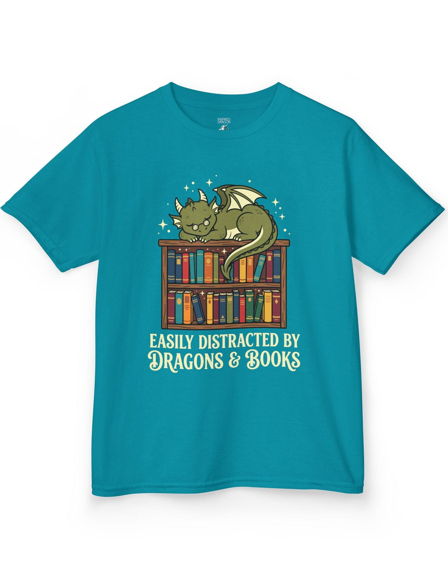 Easily Distracted by Dragons & Books shirt in tropical blue with a sleepy bookworm dragon lounging on a colorful bookshelf