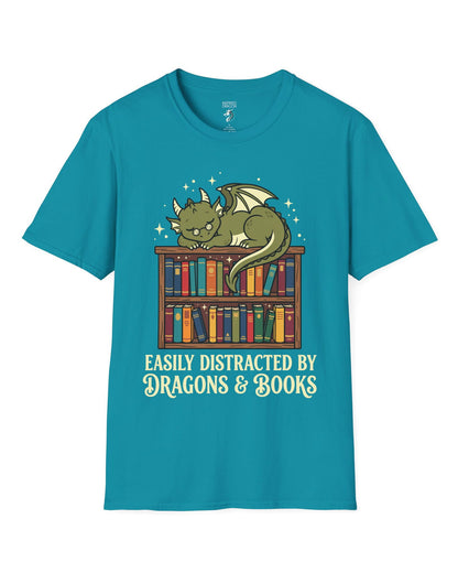 Easily Distracted by Dragons & Books shirt in tropical blue with a sleepy bookworm dragon lounging on a colorful bookshelf