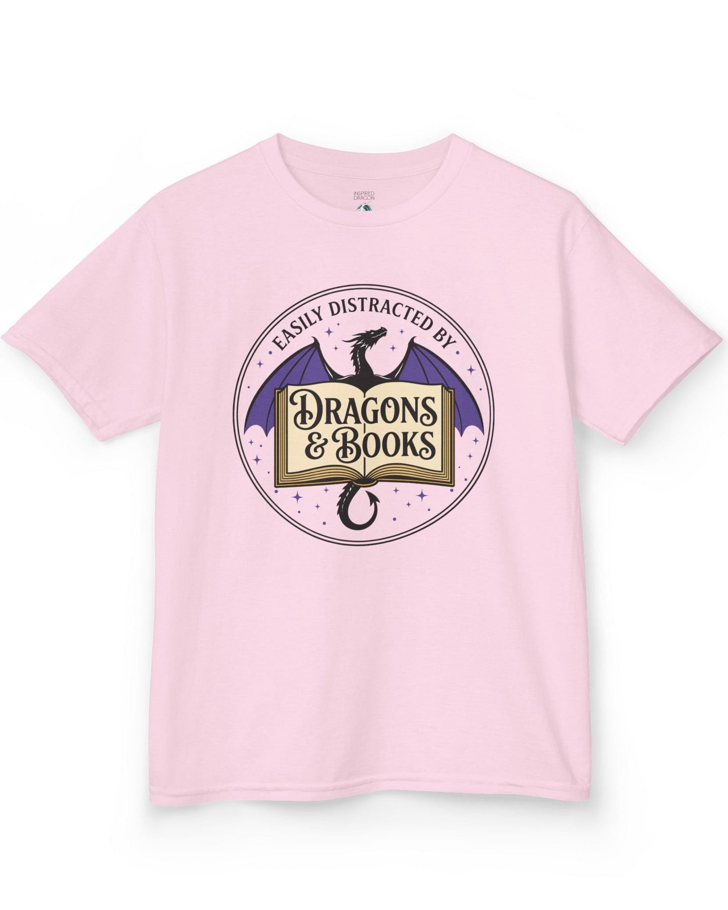 Easily Distracted shirt in light pink with a mystical dragon, open book, and cozy fantasy reader vibes