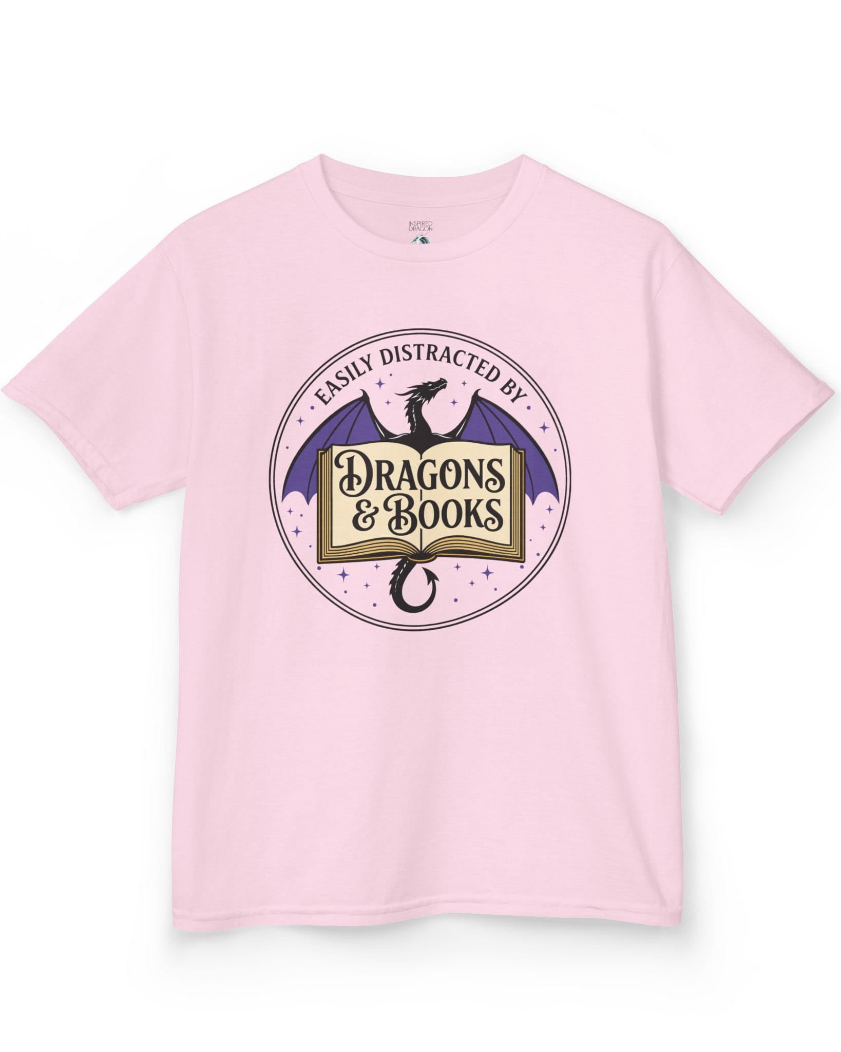 Easily Distracted shirt in light pink with a mystical dragon, open book, and cozy fantasy reader vibes