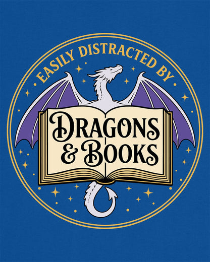 Easily Distracted shirt in royal blue with a mystical dragon, open book, and cozy fantasy reader vibes