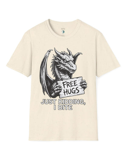 Just Kidding, I Bite shirt in natural featuring a dragon holding a Free Hugs sign with a mischievous warning