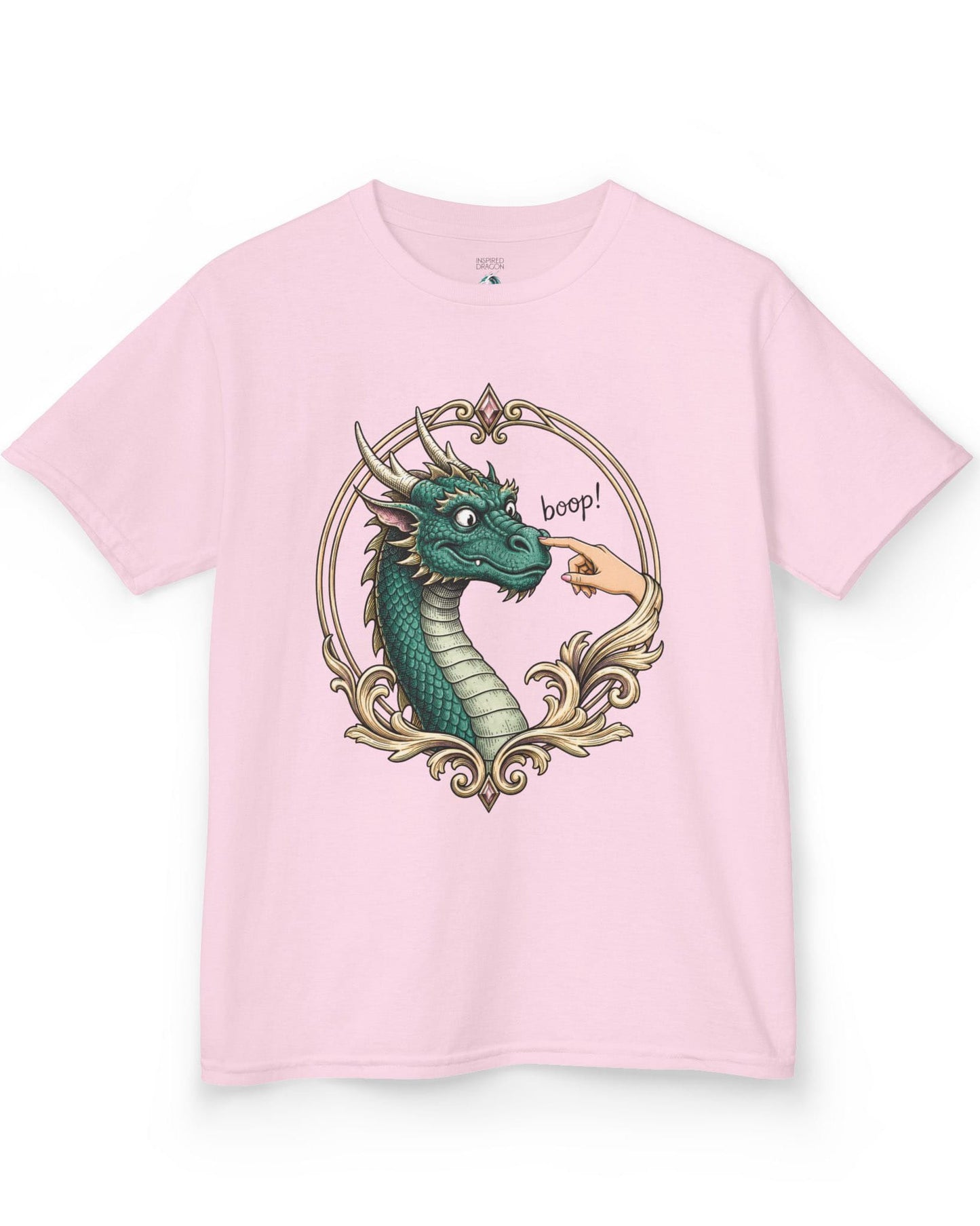 The Golden Boop shirt in light pink featuring a wide-eyed green dragon getting its nose booped by a feminine hand