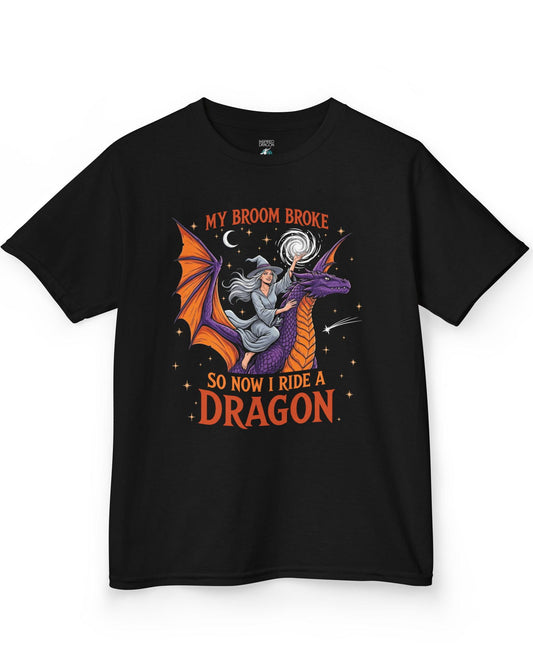 My Broom Broke Magical shirt in black featuring a magical witch riding a purple dragon beneath a starry night sky