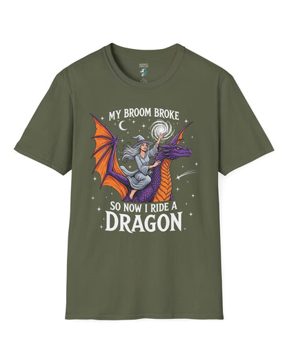 My Broom Broke Magical shirt in military green featuring a magical witch riding a purple dragon beneath a starry night sky