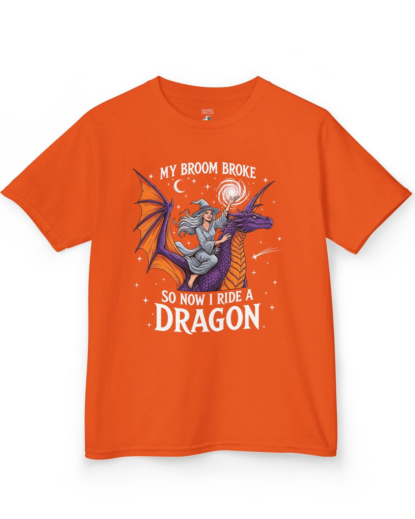 My Broom Broke Magical shirt in orange featuring a magical witch riding a purple dragon beneath a starry night sky