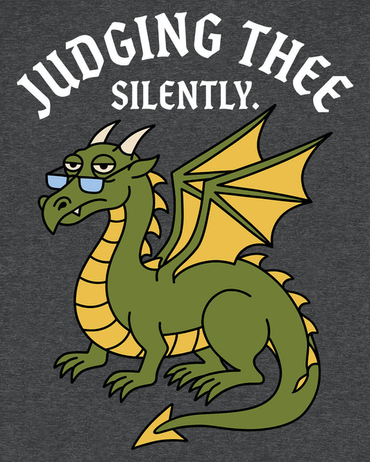 Judging Thee Silently shirt in dark heather featuring a judgmental green dragon with glasses, folded wings, and text