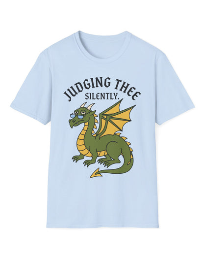 Judging Thee Silently shirt in light blue featuring a judgmental green dragon with glasses, folded wings, and text